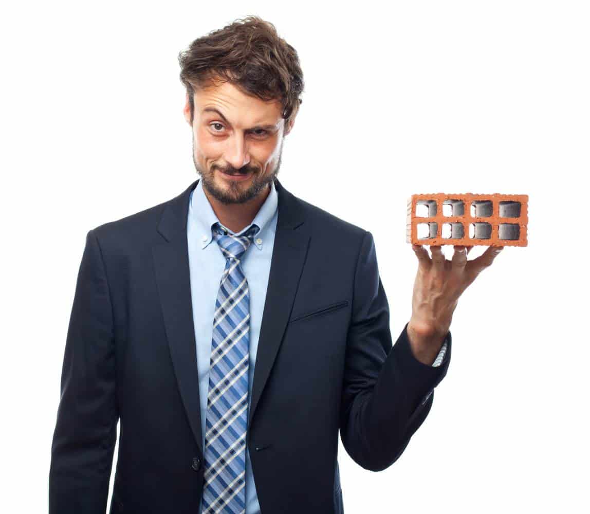 man-holding-a-brick