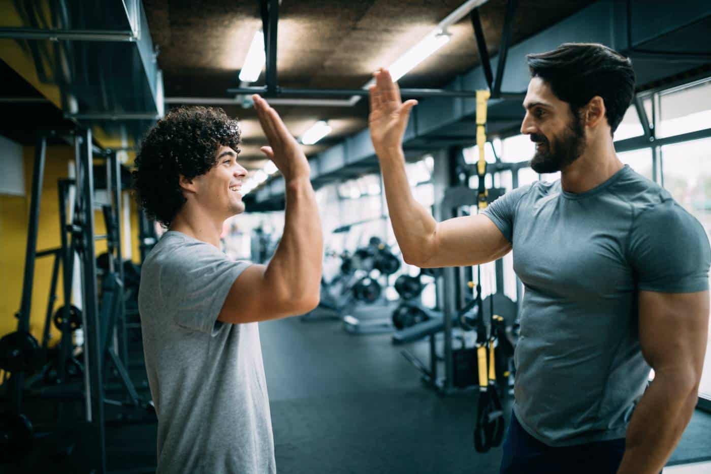 Man doing workout with a personal trainer