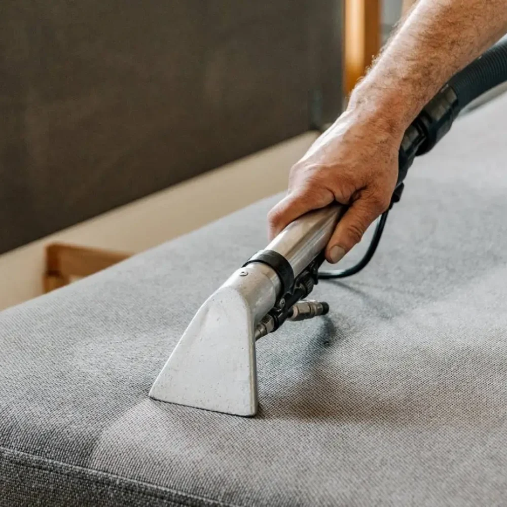 Professional cleaning service deep cleaning sofa at home.